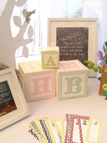 Details from the book-themed baby shower, including "Goodnight Moon" and custom alphabet blocks. The theme was designed to inspire a lifelong love of reading.