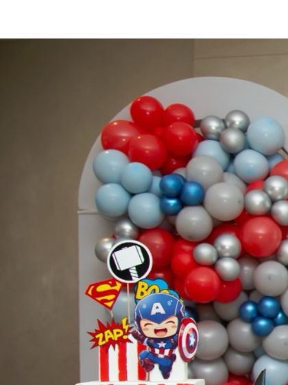 A close-up of a Captain America prop, part of our collection of adorable baby superhero decorations.