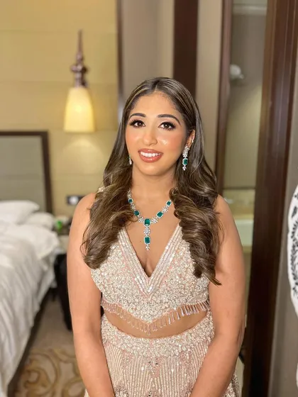 Sera looking confident and ready to celebrate in her shimmering outfit.