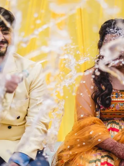 The bride gets the full force of the champagne spray in this hilarious, action-packed photo.