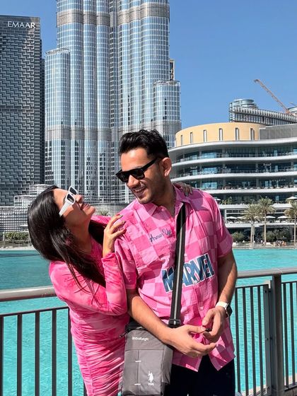 Sharing a laugh with my husband in Dubai. This picture captures the fun and stylish vibe of our vacation wardrobe.