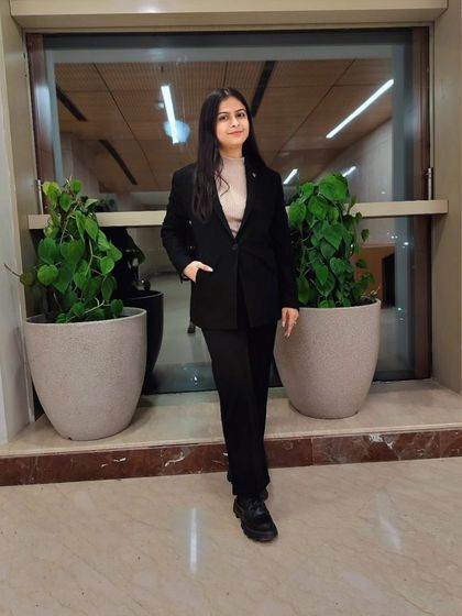 A full-length shot in my professional attire. Ready to stand up for my clients in court.