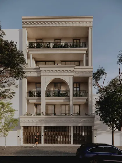 For a duplex residence in Delhi, we designed a stately neo-classical elevation using Dholpur stone. The design is rooted in a shared language of symmetry and proportion, creating a timeless presence for two brothers within a single, harmonious structure.