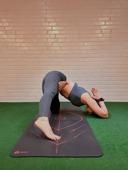 A post-festival reset with a humble bow in this variation of Humble Warrior. This pose is about gratitude, stretching out the body, and finding calm after a period of celebration.