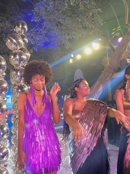 Models dancing at the finale, showcasing the vibrant and dynamic spirit of the collection.