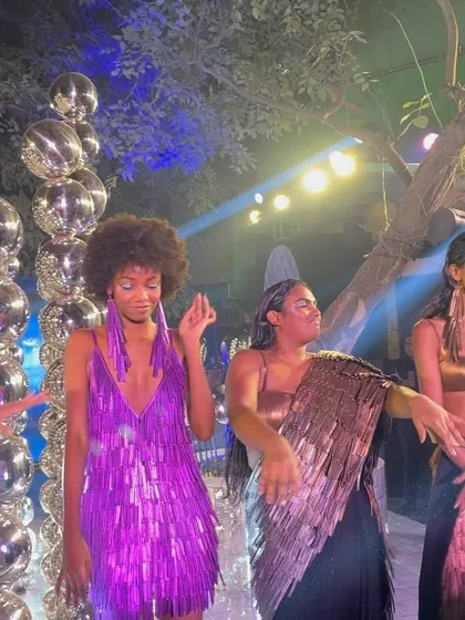 Models dancing at the finale, showcasing the vibrant and dynamic spirit of the collection.