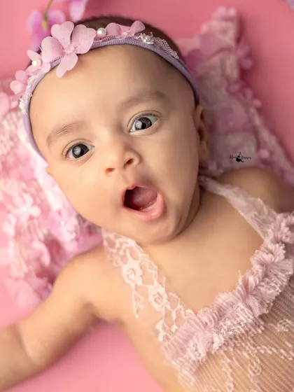 A tiny yawn from our little flower fairy! These spontaneous, unposed moments are often the most heartwarming and authentic captures from a newborn session.