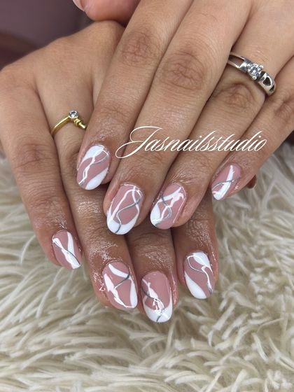 A beautiful abstract design using white and silver lines over a neutral pink base. It looks like delicate marble.