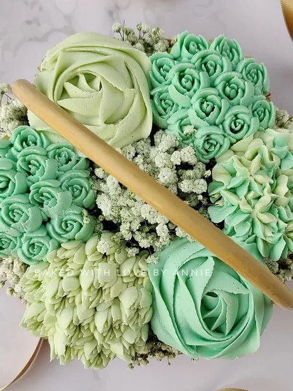 This monochromatic green cupcake bouquet shows how I can customize colors to fit a specific theme. The different shades and piping styles create a sophisticated and unique look.