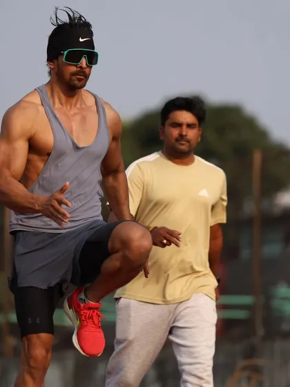 Watching over Harshvardhan Rane as he performs high knee drills, a testament to his hard work.