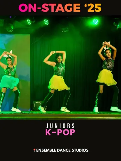 Our juniors K-Pop group performing a high-energy routine. K-Pop dance classes are one of our most popular offerings for teens, focusing on sharp, synchronized choreography.