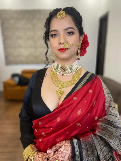 A classic reception look featuring a timeless red lip and defined eyes. I focused on creating a flawless base that lasts through the night while still looking like real skin, complemented by a traditional red rose bun.
