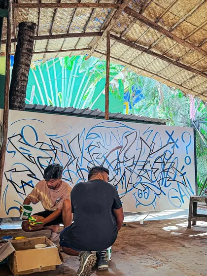 Here I am working on the Goa graffiti piece. You can see the initial sketch and layering process, showing how these complex letters come together.