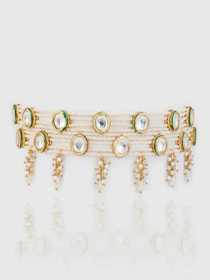 A wider version of our kundan and pearl choker, featuring two rows of pearls for a more dramatic statement.