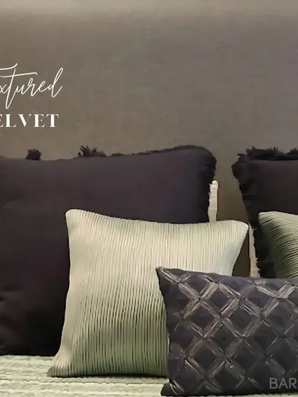 A close-up of the textured velvet and corduroy pillows we used for styling. Mixing textures is key to creating a cozy and visually interesting space.