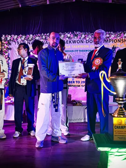 Receiving a certificate of appreciation at the National Taekwon-Do Championship. Our academy concluded the event with an impressive haul of 3 Gold, 2 Silver, and 1 Bronze.