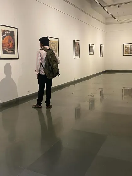 A visitor contemplating a work at the Jehangir Sabavala exhibition.