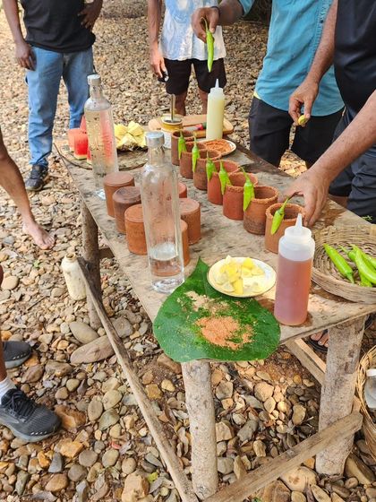 A rustic table set up for our Urrak tasting session. We use local ingredients and traditional terracotta cups for an authentic experience.