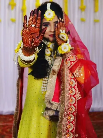 A beautiful bride showing off her fresh henna during her haldi ceremony. My henna is completely safe and natural, perfect for all your important wedding events.