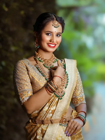 A full view of a traditional bridal ensemble featuring our layered necklaces and matching maang tikka. The antique finish gives the jewellery an authentic, heirloom quality.