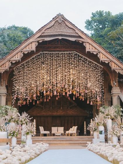 This mandap design was all about creating a dreamy, ethereal feel within a rustic, natural setting. The cascading floral chandelier made of thousands of delicate blooms served as the stunning centerpiece for the ceremony.