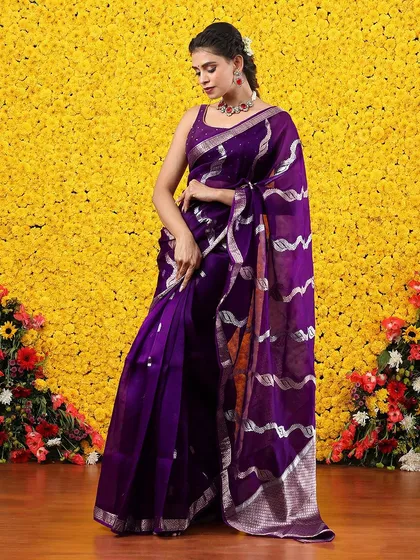The full, standing view of the purple and silver organza saree, a perfect blend of tradition and modernity.
