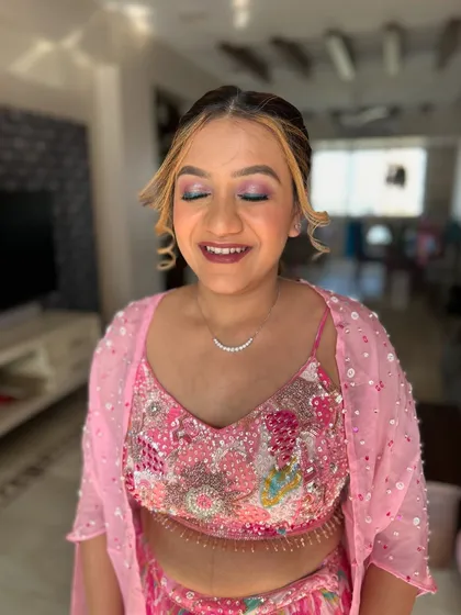 A happy, smiling shot. The client looks radiant and ready for her event.