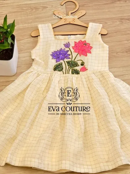 A sweet off-white checked frock with lotus embroidery, perfect for summer events and available in my ready stock.