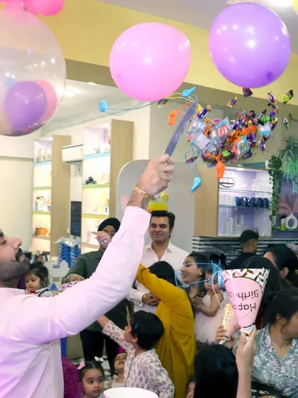 The excitement of a candy-filled balloon pop! We incorporate fun activities like this to make the cake-cutting ceremony even more special.