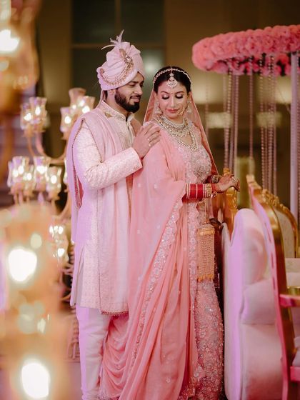 A beautiful portrait from a wedding in Jammu. The groom's gentle touch and the bride's serene expression create a soft, romantic mood.