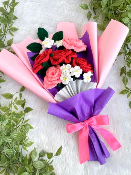 Another angle of the sweetheart bouquet, showing how the pink and purple wrapping comes together with a bright pink bow.