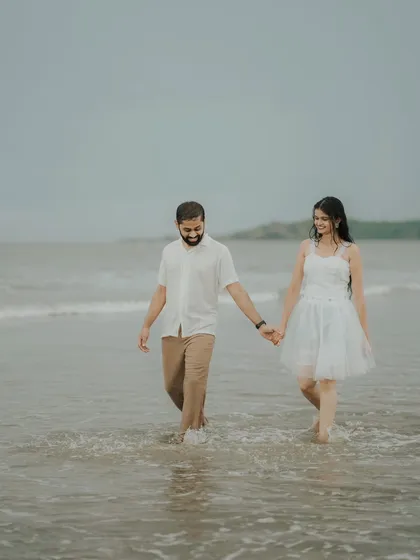 A simple walk, hand in hand, through the shallow waters. This candid shot of Pragati and Swapnil shows the easy comfort of their relationship.
