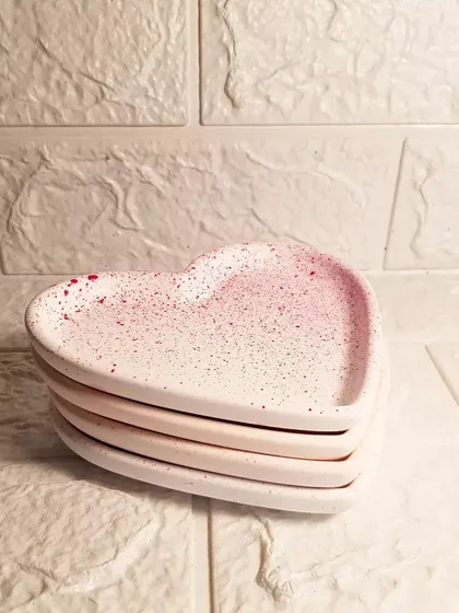 A stack of our mini heart dishes, ready to be packed for our Mother's Day collection.