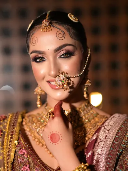 A playful and happy close-up. The bride's smile reaches her eyes, which are enhanced with a beautiful blend of shimmer and smoke.
