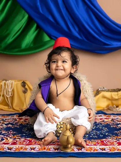 A joyful smile from our little street rat. The Aladdin theme is one of my most popular and fun setups for baby boys.