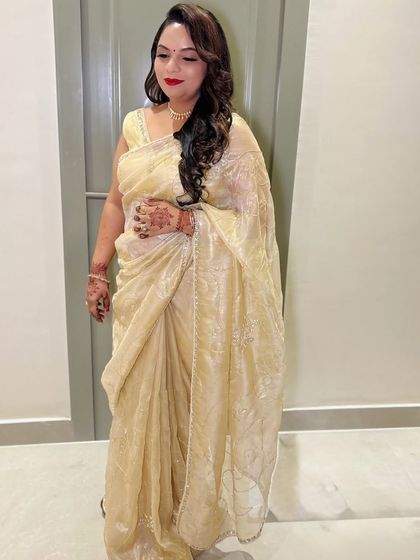 A glamorous party look with a bold red lip and soft waves.