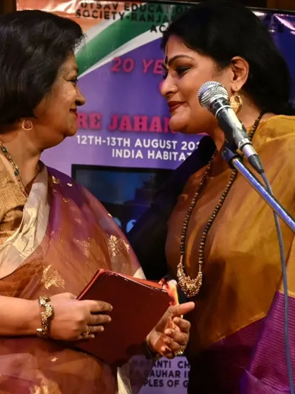 A warm exchange on stage. These moments of camaraderie are what make the journey special.