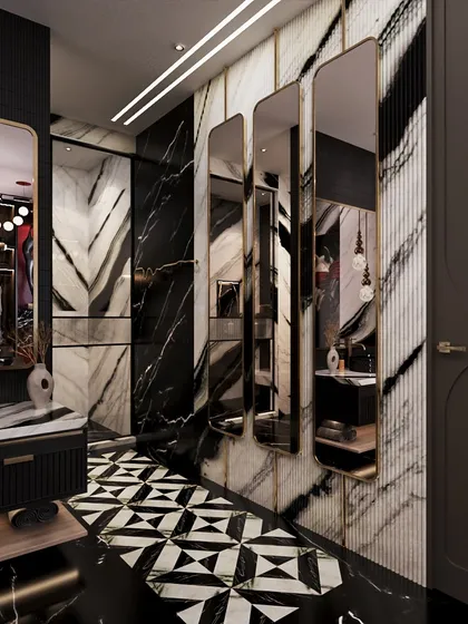 A series of vertical mirrors reflects the bold patterns of the room, enhancing the sense of drama and space. The design is curated to feel entirely unforgettable.