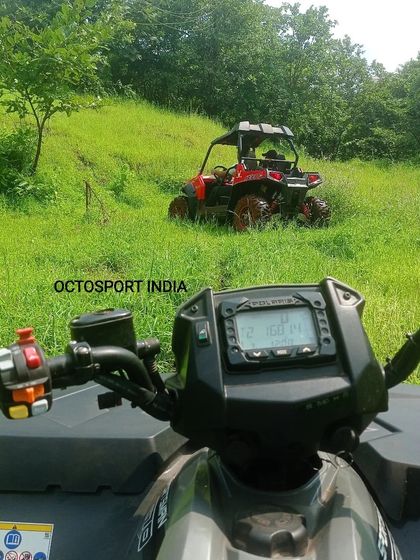 Having some fun with the toys at our campsite. This is a point of view shot from one of my Polaris ATVs, looking out at another RZR buggy on the grassy track. This is just a taste of the adventure that awaits your team.