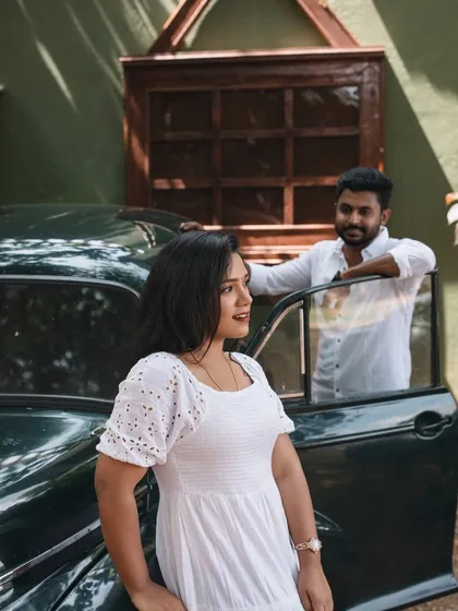 Another angle featuring the vintage car, this time with a focus on the couple's interaction. This shows how you can use the props to create different compositions and tell a story.