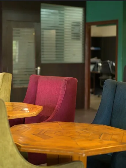 Work doesn't have to be confined to four walls. My space offers colorful, comfortable seating and a view into our private meeting rooms, making your workday more dynamic.