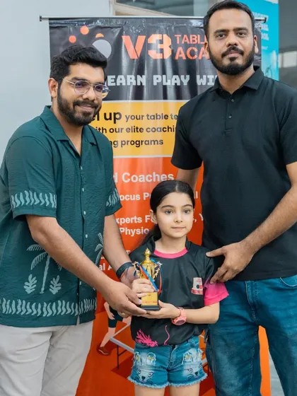 A young U-11 girls' participant receiving her trophy. I make sure every event is well-organized, allowing players and their families to enjoy the experience.
