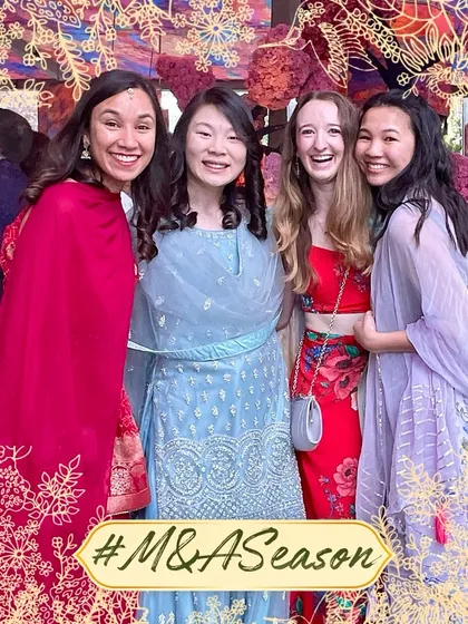 A beautiful moment of friendship between guests from around the world, captured at an Indian wedding with our custom photo frame.