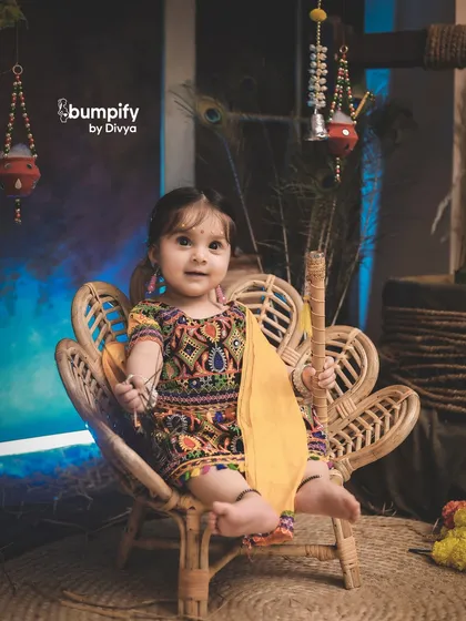 A close up of our little Radha, her sweet smile and traditional dress making for a perfect Janmashtami portrait.