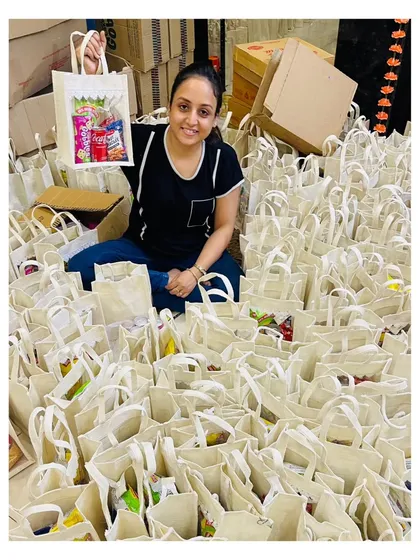 This is me, the *marzi ki malkin* behind Winsome Hampers, surrounded by a successfully executed bulk order. I personally manage every project to ensure quality, whether it's for a small team or a large corporation needing hundreds of gifts delivered across India.