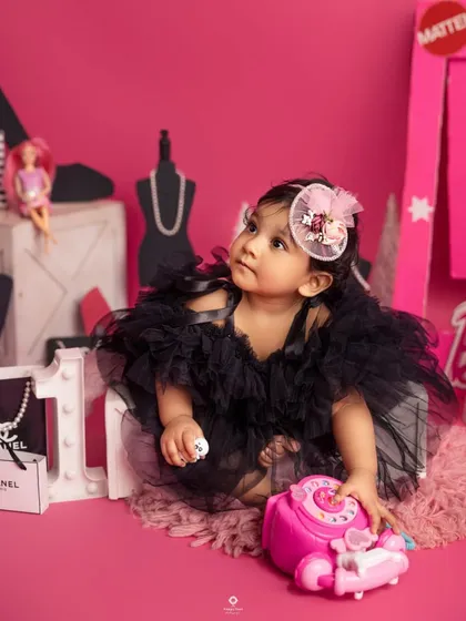 A thoughtful moment in her pink Barbie world. Even in a playful theme, I always look for those quiet, beautiful expressions that reveal your child's sweet personality.