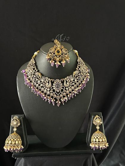 A beautiful Victorian choker with peacock motifs and purple bead drops. This unique piece is perfect for someone looking for something different.