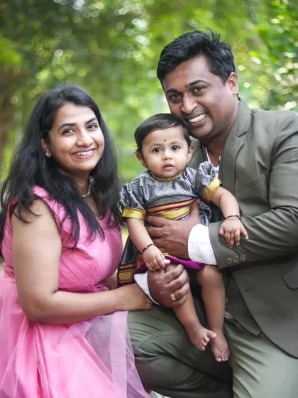 A classic family portrait taken in a lovely green park. My goal is to make everyone feel comfortable, resulting in natural smiles and a photo you'll cherish for years.