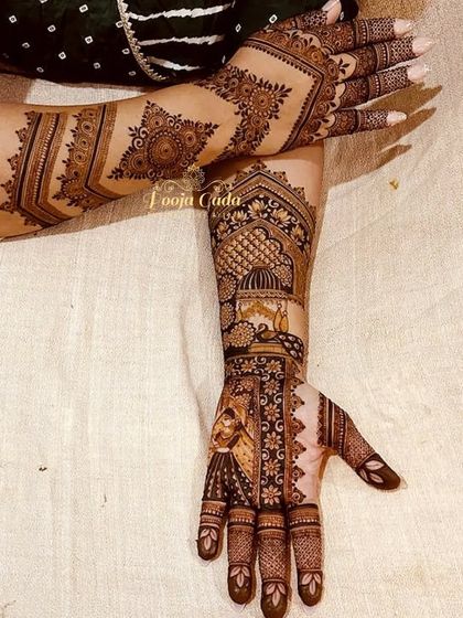 When your bride wants minimal bridal henna, you create something like this. This design features a beautiful portrait on one arm, while the other has a more open, pattern-based design, creating a unique and balanced look.