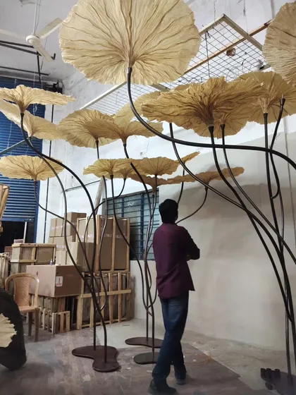 So much of our magic happens behind the scenes, in the workshop. Here, you can see the giant Victoria Lily-inspired lights taking shape before an exhibition. This hands-on process, from sketching to final assembly, is where we pour our hearts into every detail, ensuring each piece has a soul.